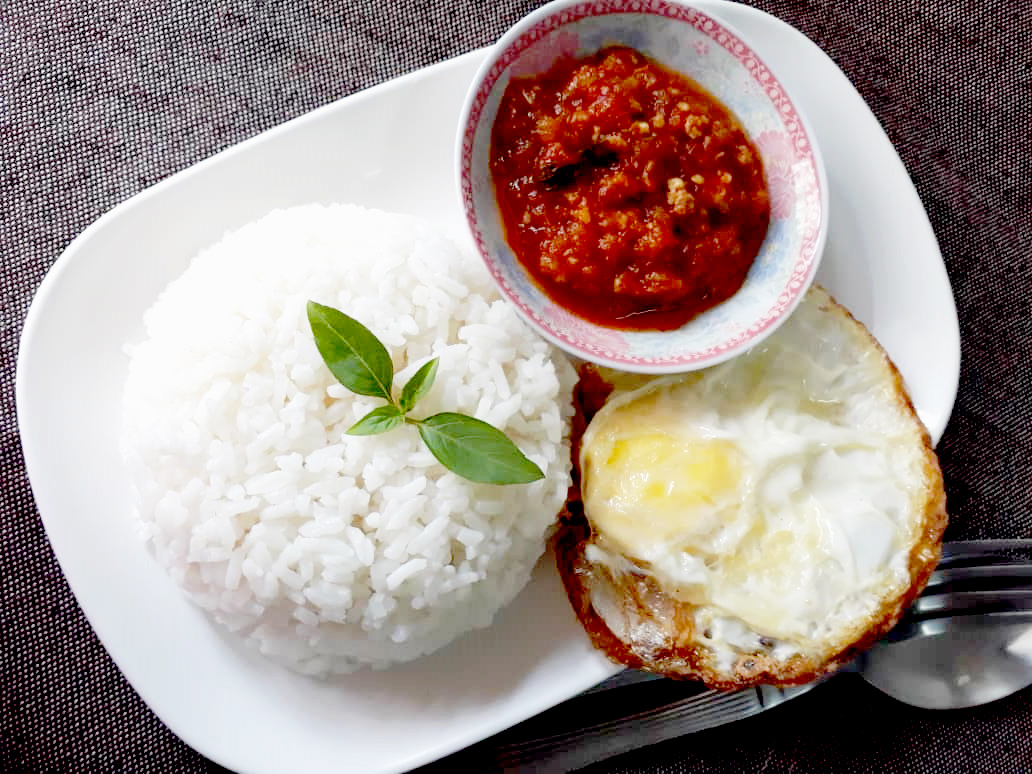 Image of White rice served with Thai style sambal and fried egg prepared by home chef