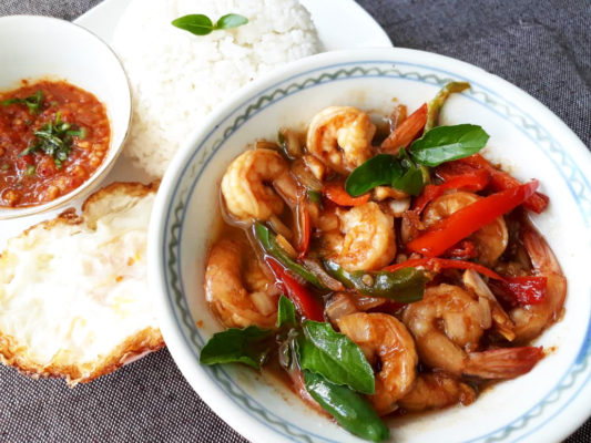 Image of delicious Stir Fried Prawn cooked with Thai Basil and Chilli served with rice prepared by home chef